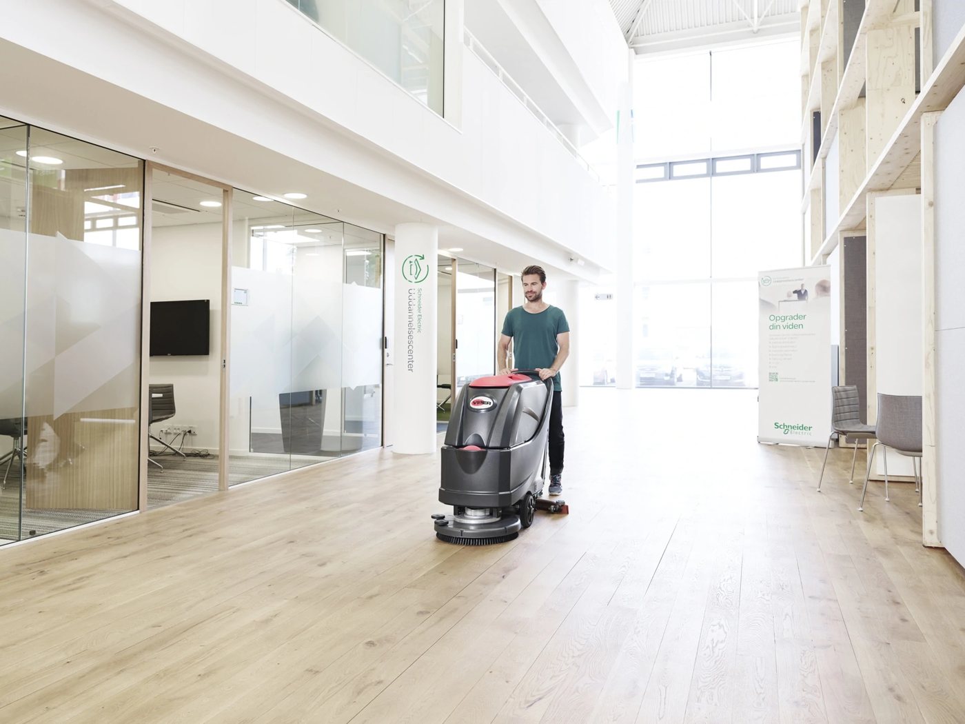 Viper AS5160 scrubber cleaning an office lobby floor