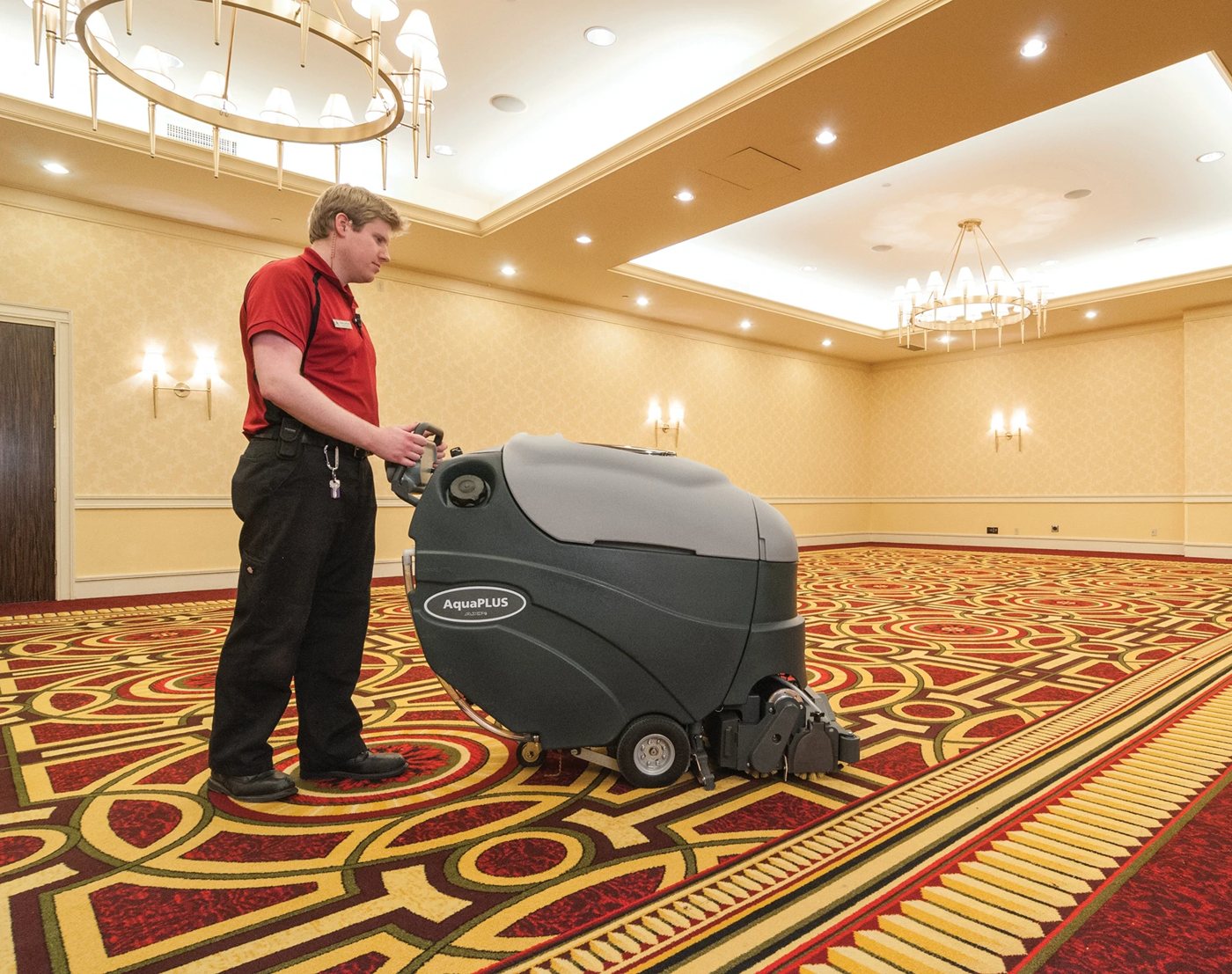 Advance AquaPLUS AXP extractor cleaning a hotel ballroom carpet