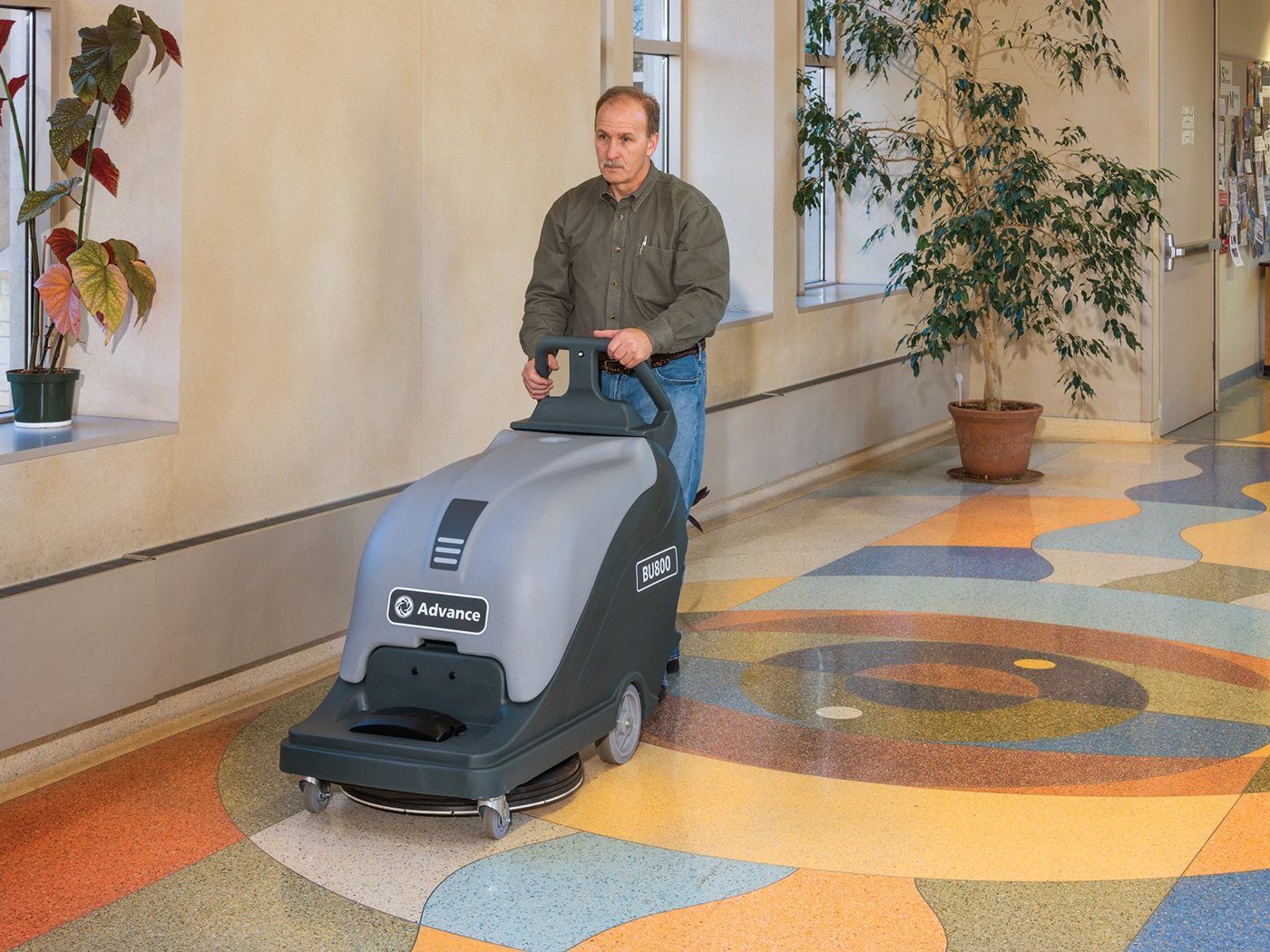 Advance BU800 burnisher in use on a polished floor