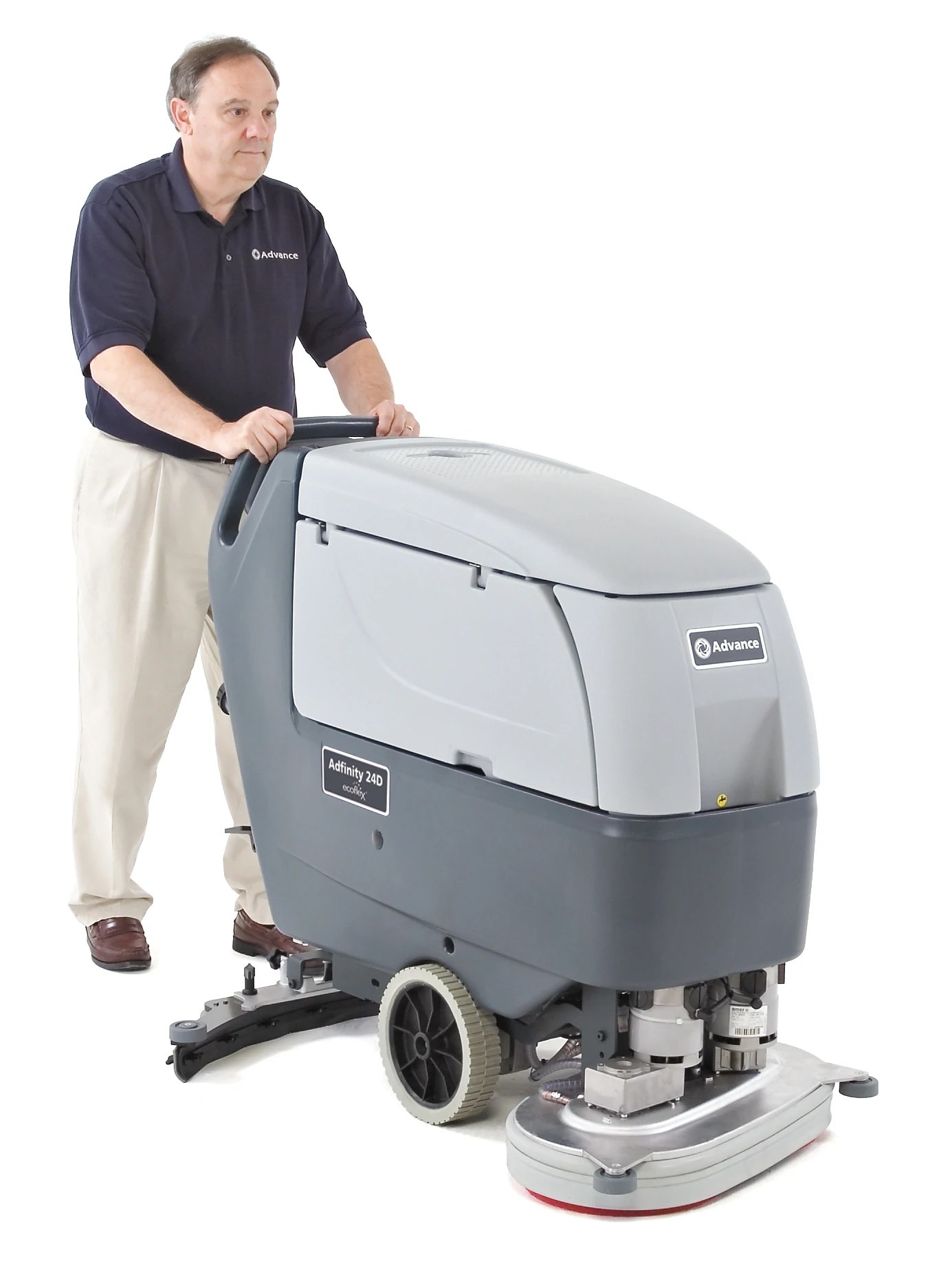 Operator guiding an Advance Adfinity X24D scrubber by its handle