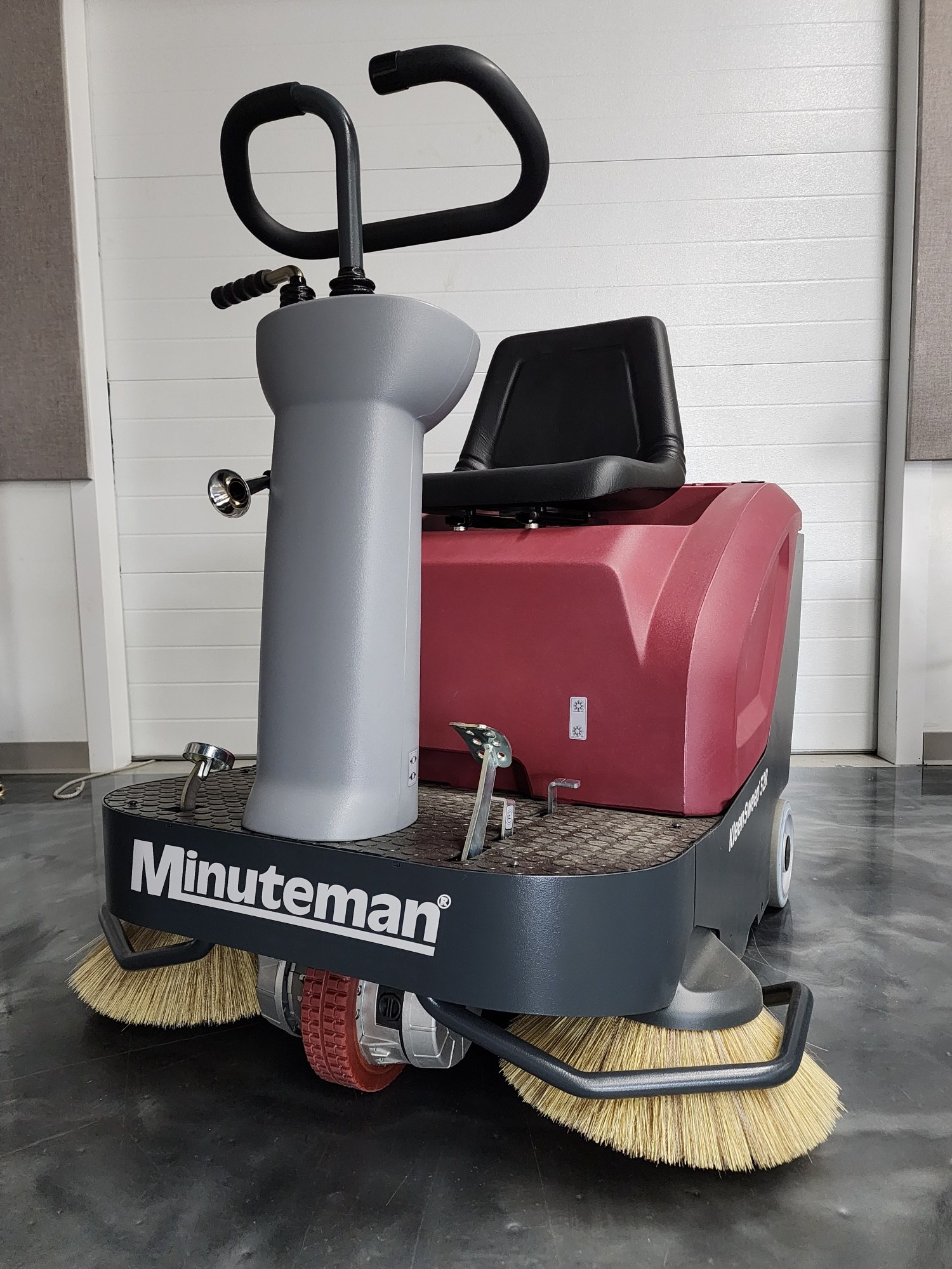 Minuteman Kleen Sweep 32R rider sweeper with operator seat, steering column and side brooms