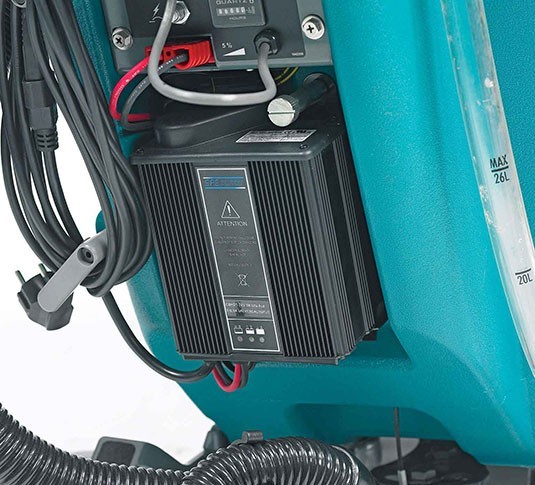 Tennant T2 on-board battery charger with its power cord wrap
