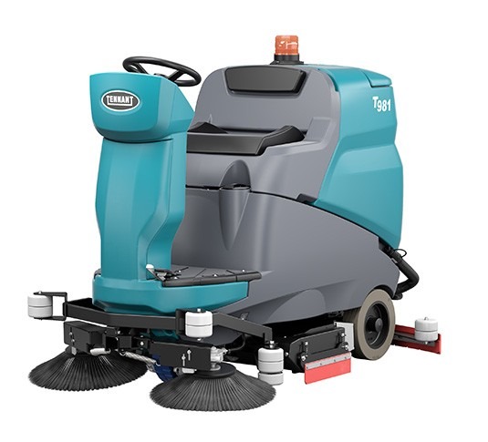 Tennant T981 cylindrical ride-on floor scrubber, left side view showing the seat, steering column and side brushes