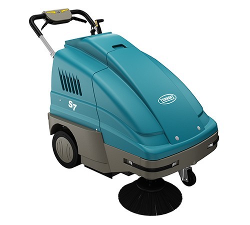 Tennant S7 battery walk-behind sweeper, front right view showing the side brush, teal hopper cover and handle