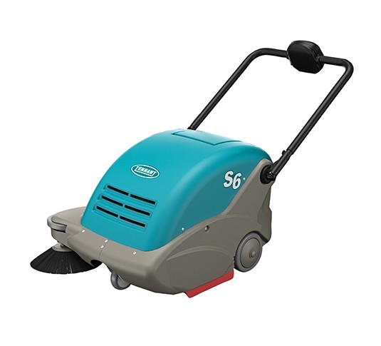 Tennant S6 battery walk-behind sweeper, front left view showing the side brush and teal hopper cover