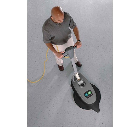 Overhead view of an operator burnishing a lobby floor with the Tennant BR-2000-DC