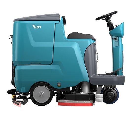 Tennant T681 ride-on scrubber, right side view showing the recovery tank, operator seat and squeegee