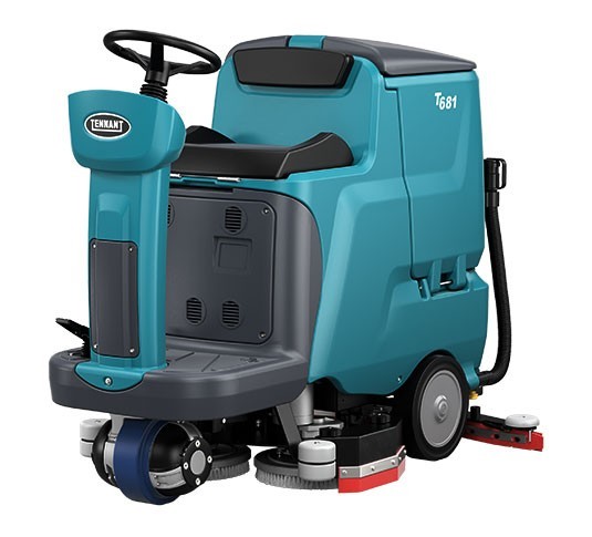 Tennant T681 small ride-on floor scrubber, front left view showing the seat, steering wheel and dual disk scrub deck