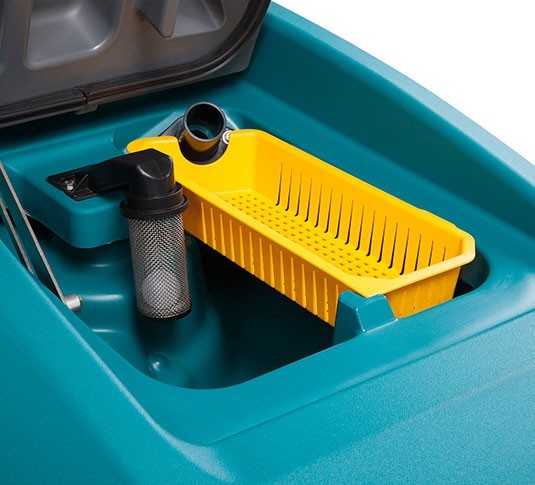 Tennant T600 recovery tank opened to show the yellow debris tray and float shut-off