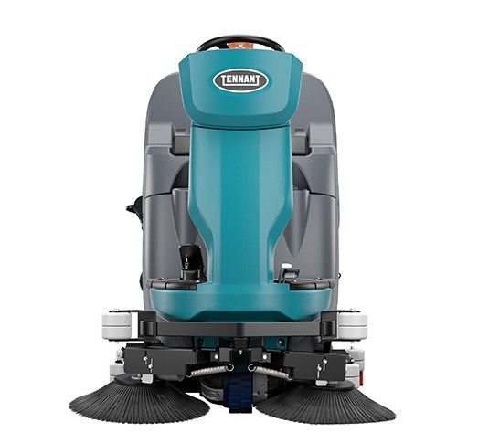 Tennant T981 cylindrical scrubber from the front, showing both sweeping side brushes