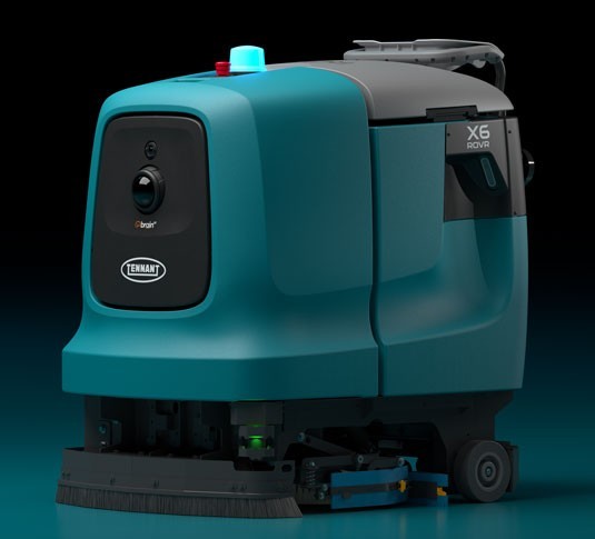 Tennant X6 ROVR autonomous floor scrubber, front view showing the camera housing and dual disk scrub deck