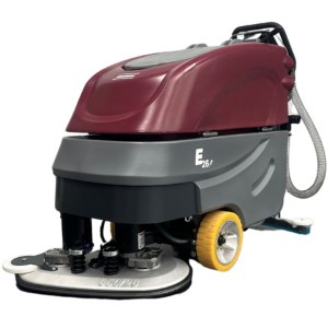 Minuteman E26 floor scrubber, front three-quarter studio view showing the disc deck, drive wheel and squeegee