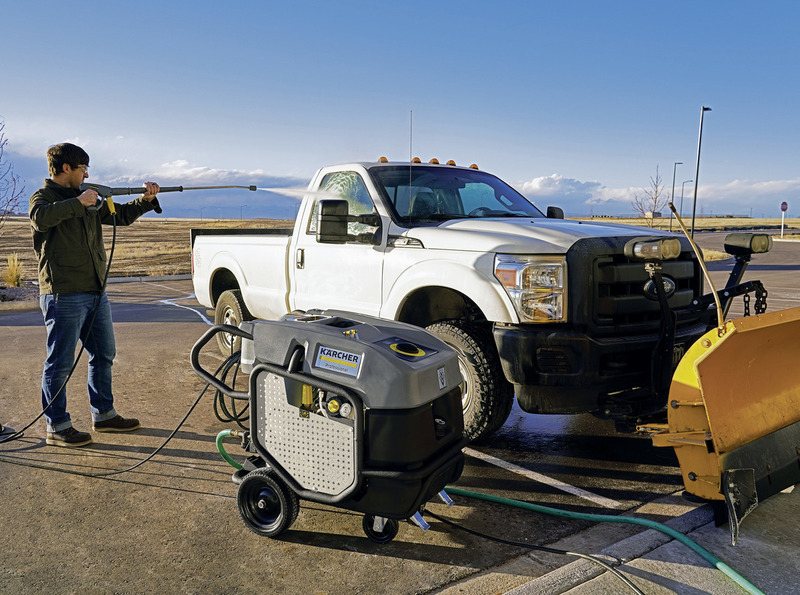 Karcher HDS hot water pressure washer cleaning a pickup truck