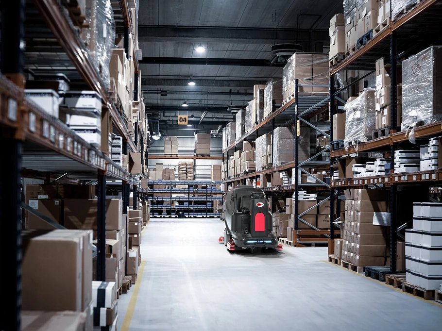 Viper AS1050R ride-on scrubber cleaning a warehouse aisle