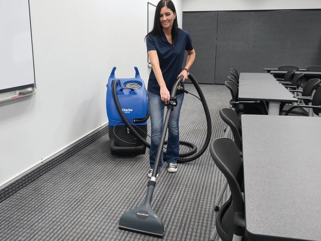 Clarke EX20 extractor cleaning carpet in a classroom
