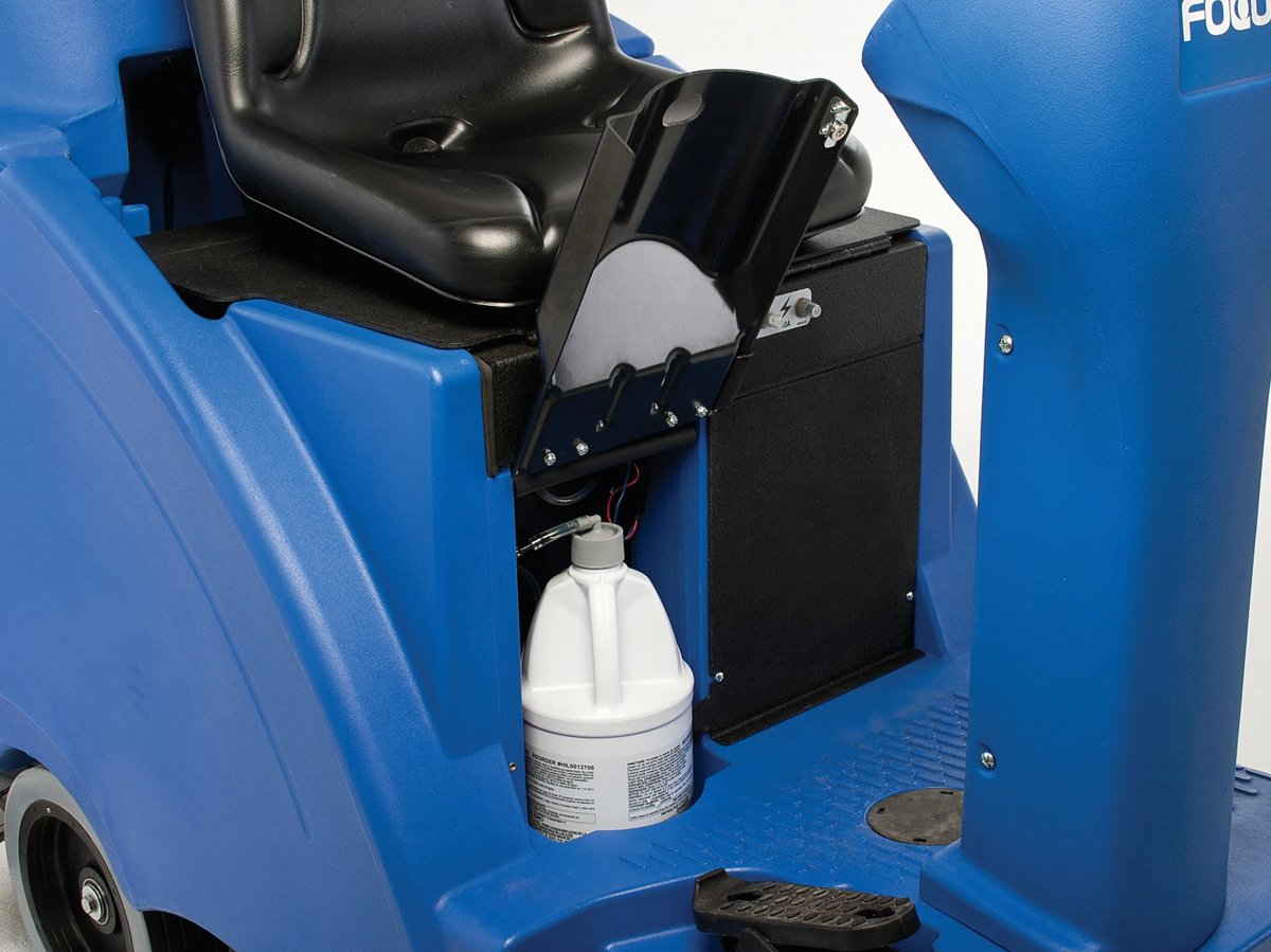Chemical Mixing System jug stored beside the seat on a Clarke Focus II Rider
