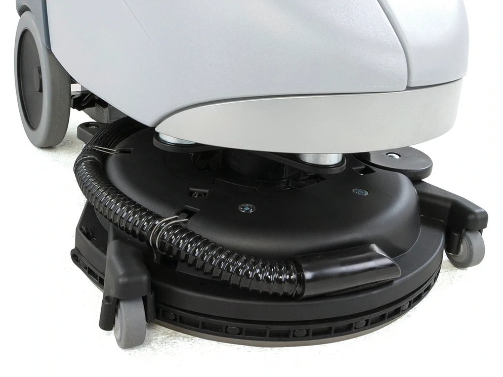 Advance SC351 rotating scrub deck with integrated squeegee turned for reverse pickup