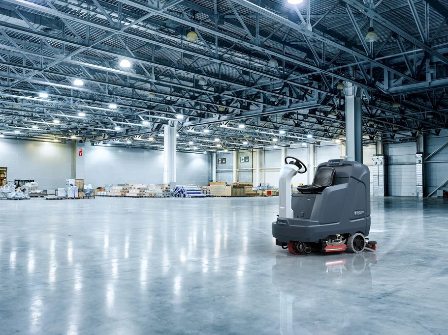 Advance SC5000 scrubbing a large polished warehouse floor