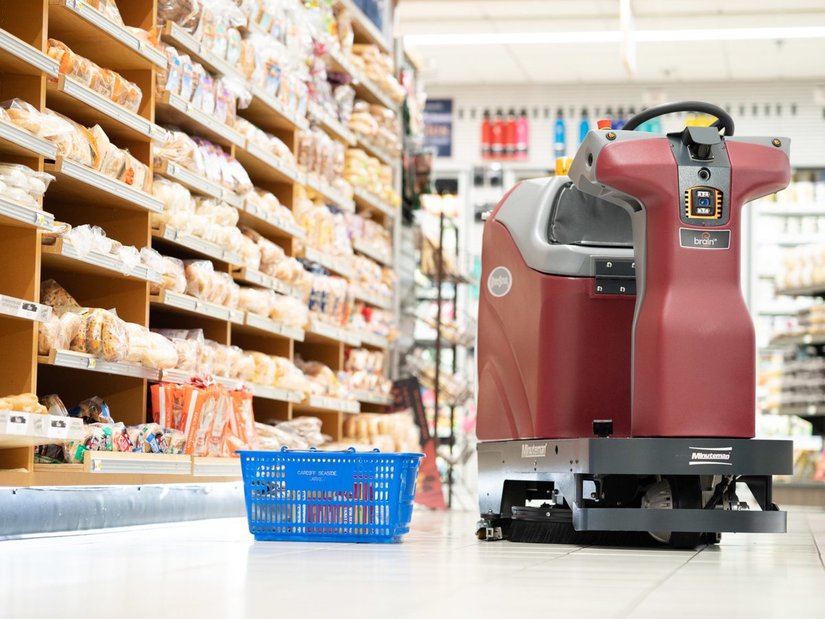 Minuteman RoboScrub 20 working autonomously beside store shelving