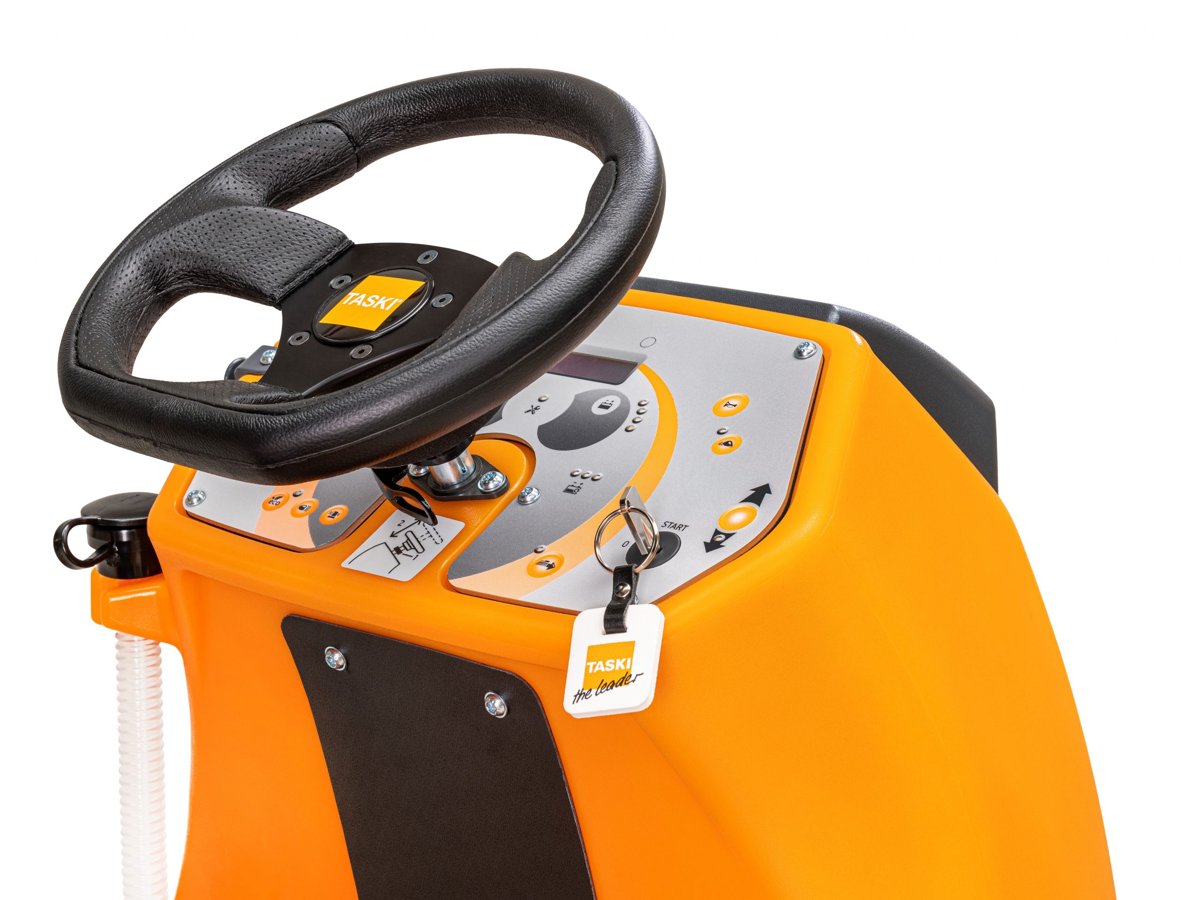 Close-up of the TASKI swingo 2100micro steering wheel and control panel