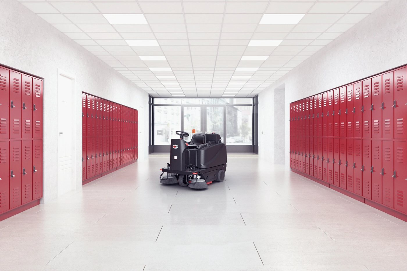 Viper ROS1300 ride-on sweeper sweeping a school hallway